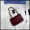 شنطة توري بورش عنابي