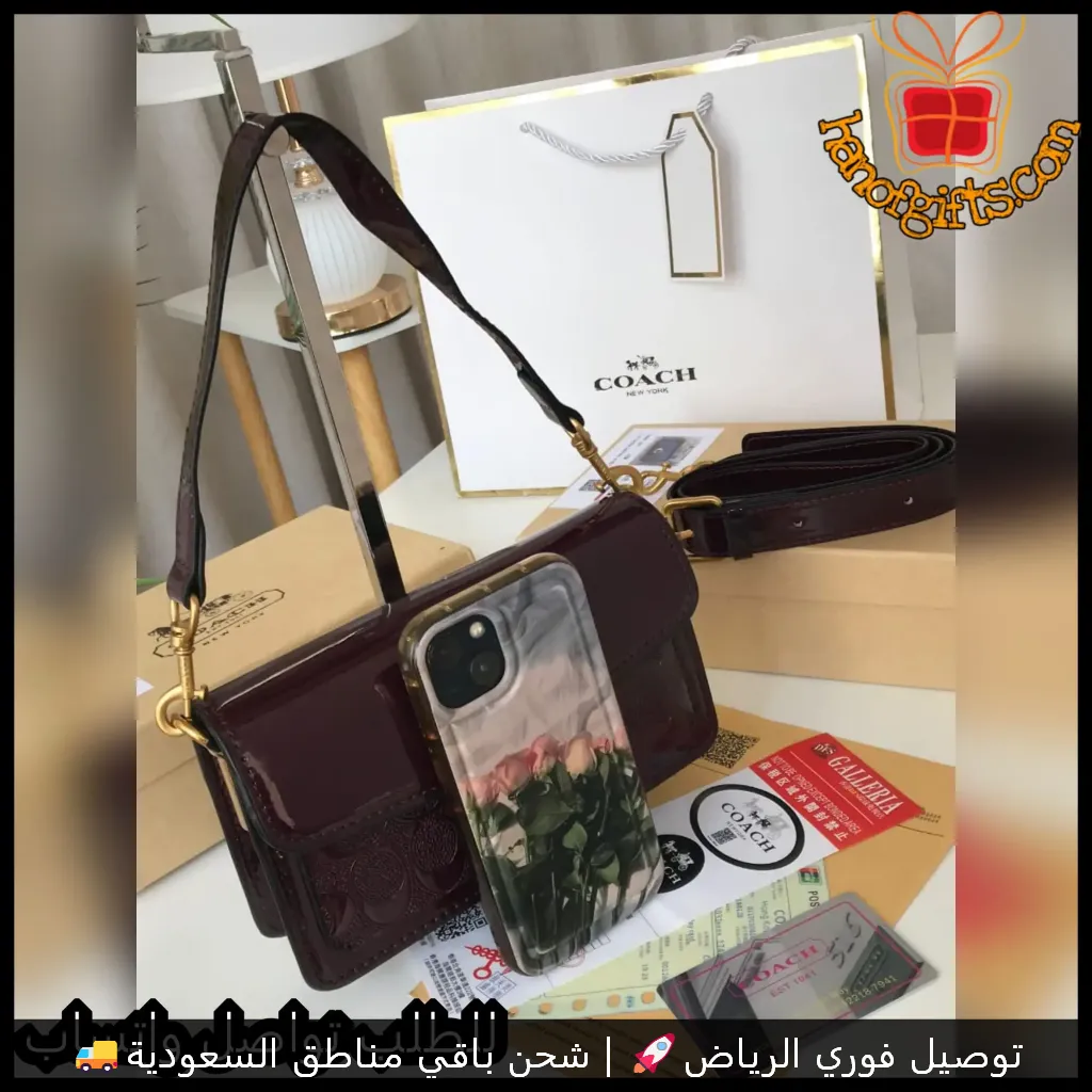 شنطة COACH نسائية عنابي غامق بتصميم لامع