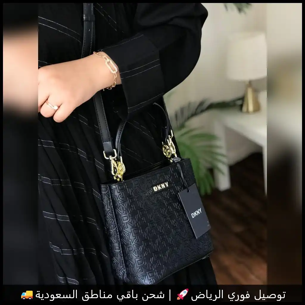 شنطة دكني جلد بلون أسود