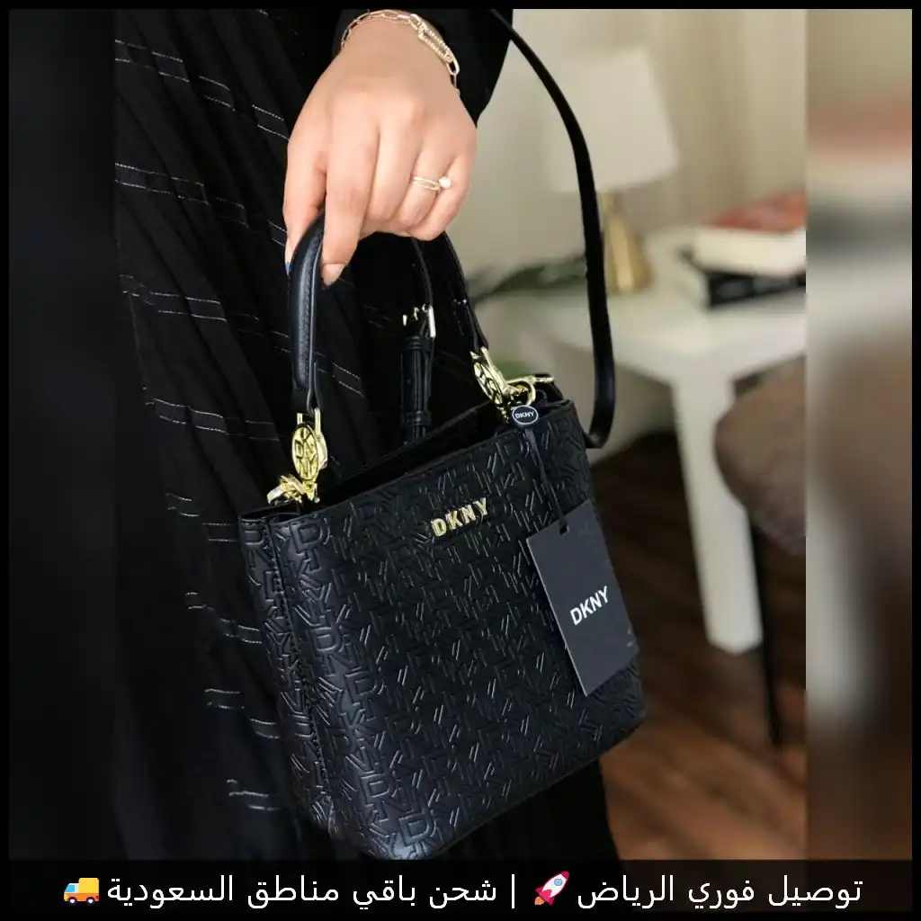 شنطة دكني جلد بلون أسود