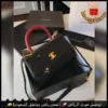 شنطة شانيل سوداء مع يد عنابي وسلسلة ذهبية