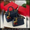 شنطة GUESS كحلي بتعليقة الكرز