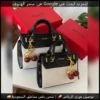 شنطة Guess بيج × أسود مع ميدالية كرز