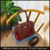 شنطة توري بورش بلون عنابي لامع