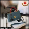 شنطة شانيل زرقاء بمسكة عنابي