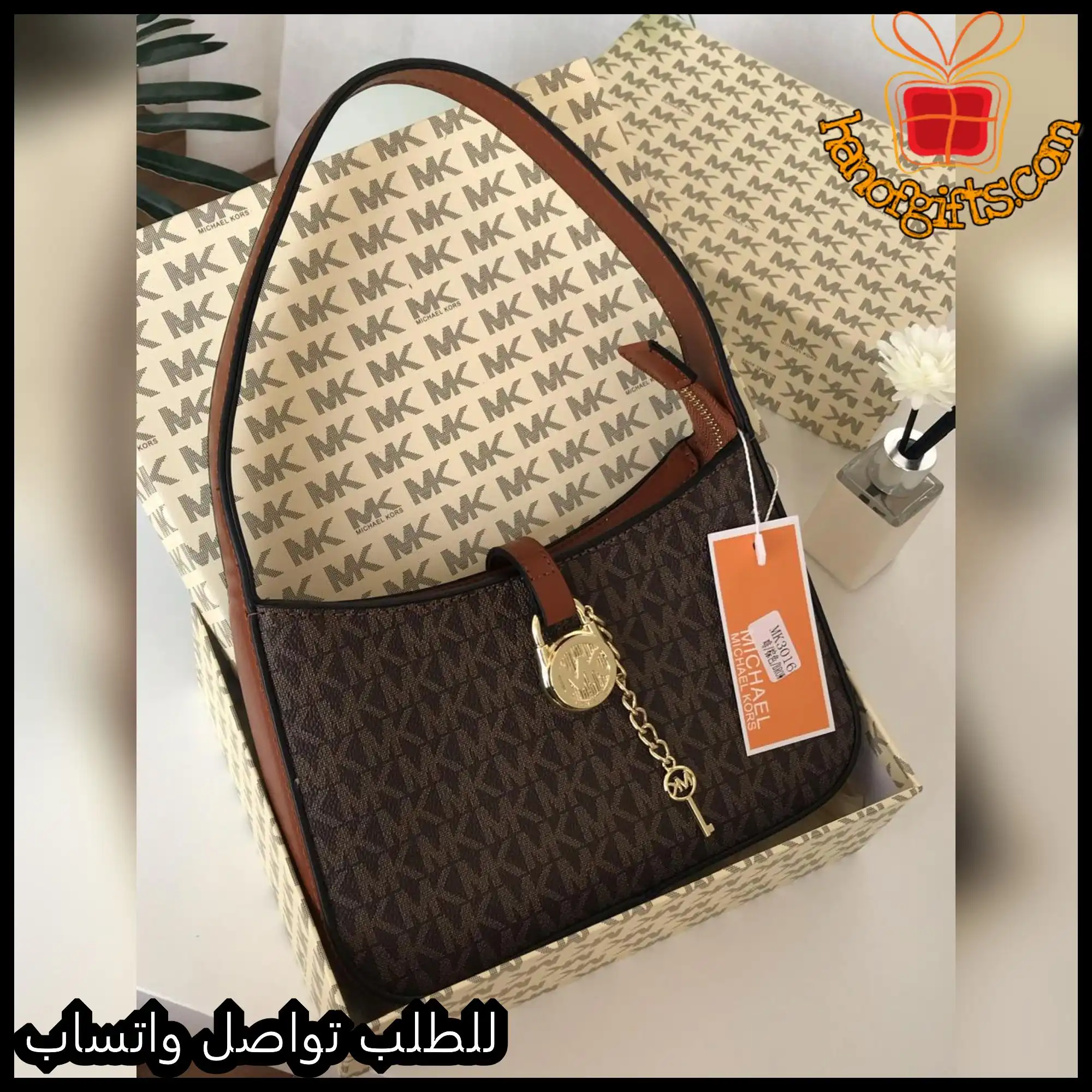 شنطة مايكل كورس بنية بنقشة MK