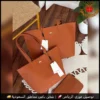 شنطة لاكوست بني كاراميل وسط و كبيرة