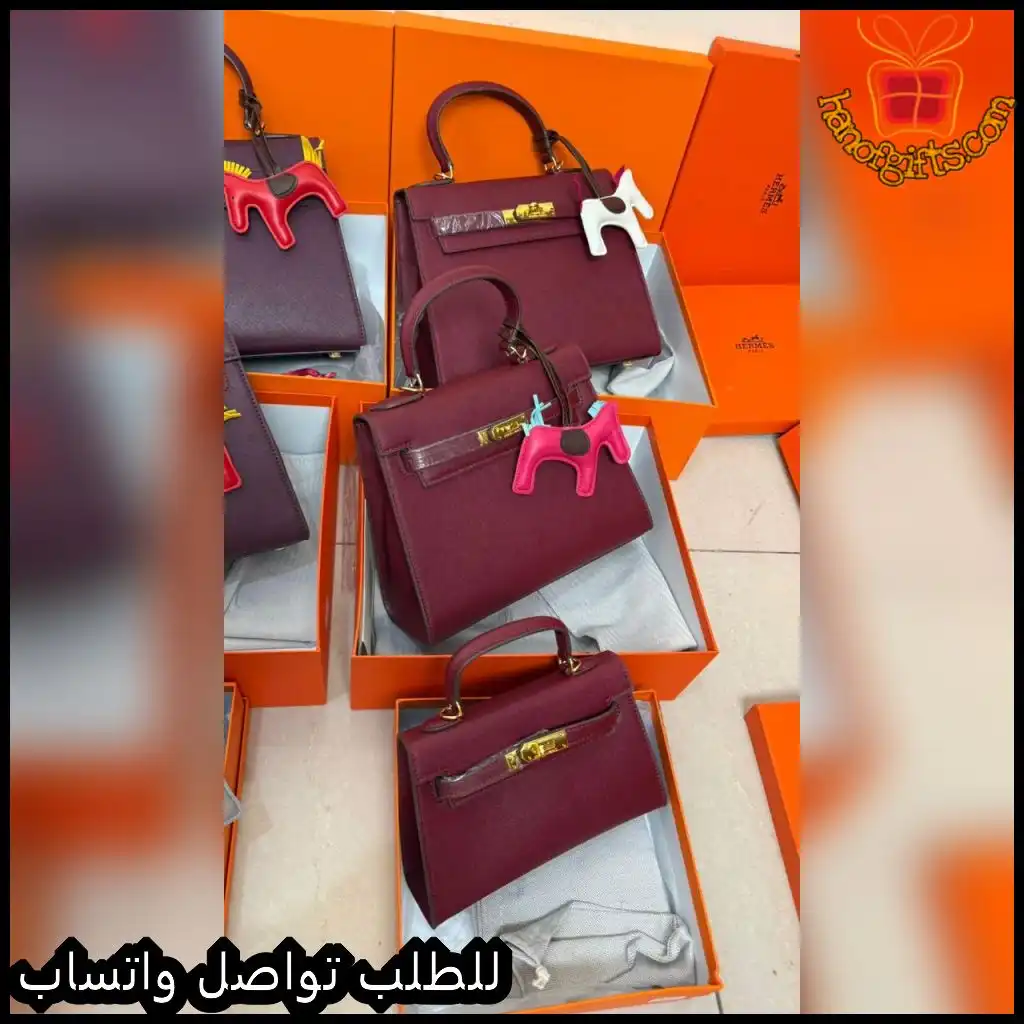 شنطة هرمز نسائية باللون العنابي مع قفل ذهبي