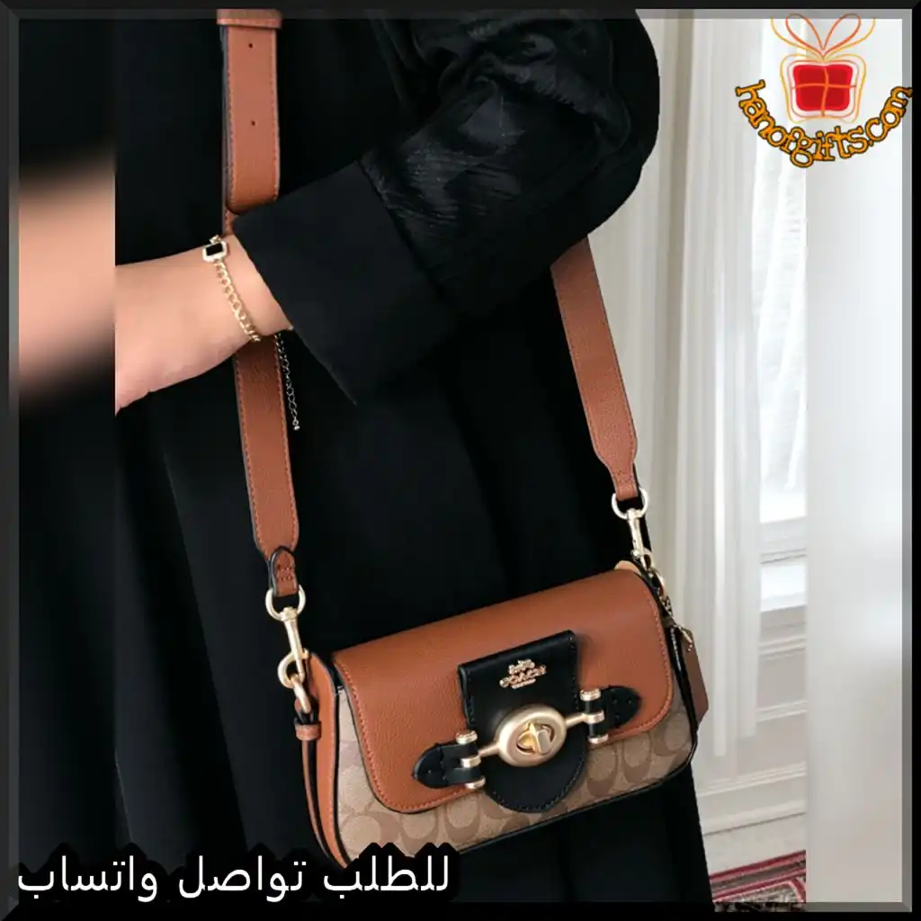 شنطة كوتش نسائية جلد بني بتفاصيل ذهبية