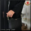 شنطة DKNY جلد أسود بنقشة الماركة