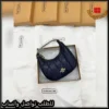 شنطة كوتش نسائية جلد مبطّن كحلي