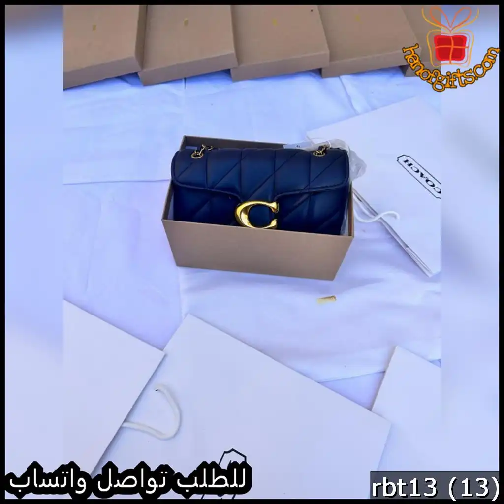 شنطة كوتش لون كحلي بتفاصيل ذهبية