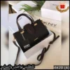شنطة دكني سوداء بتفاصيل جلد عنابي