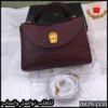 شنط اقنر عنابي غامق بملحقات الماركة