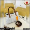 شنطة مايكل كورس أبيض بنقش MK مع أطراف جلدية بنية