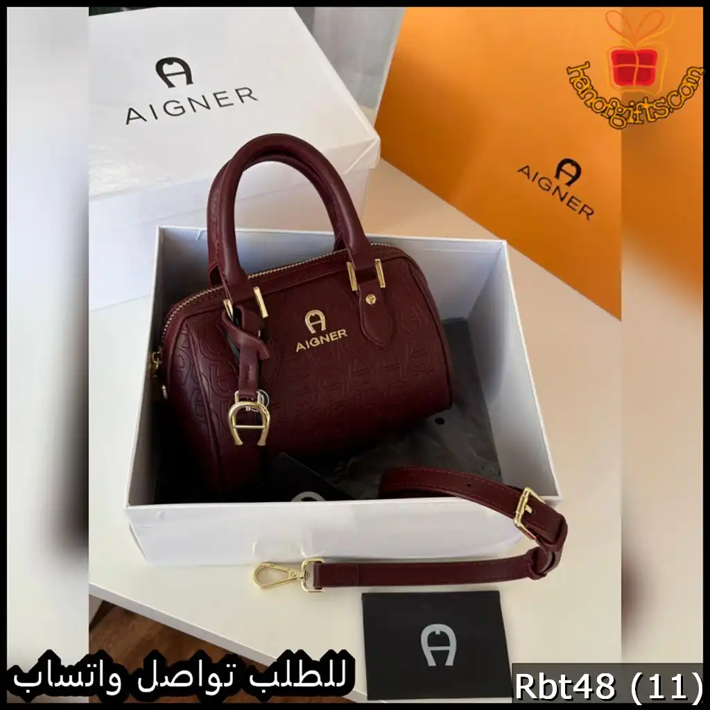 شنطة أقنر AIGNER بلون عنابي فاخر بنقشة بارزة