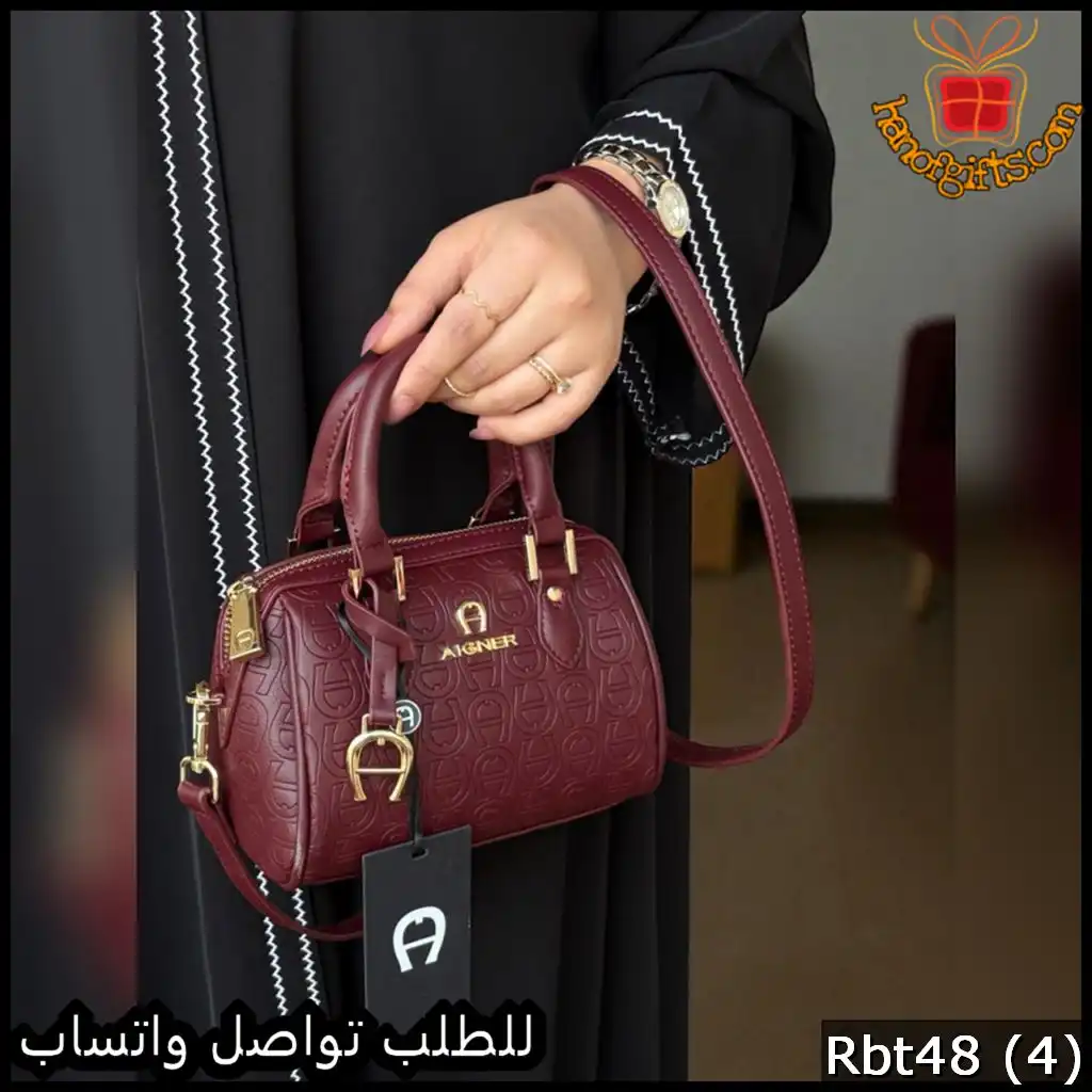 شنطة أقنر AIGNER بلون عنابي فاخر بنقشة بارزة