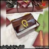 شنطة قوتشي بني ماهوجني لامع
