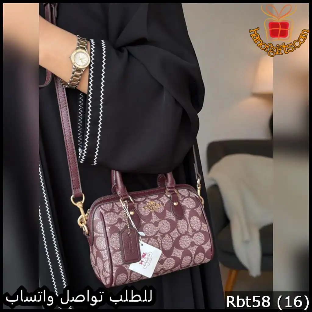 شنطة Coach العنابية المزخرفة