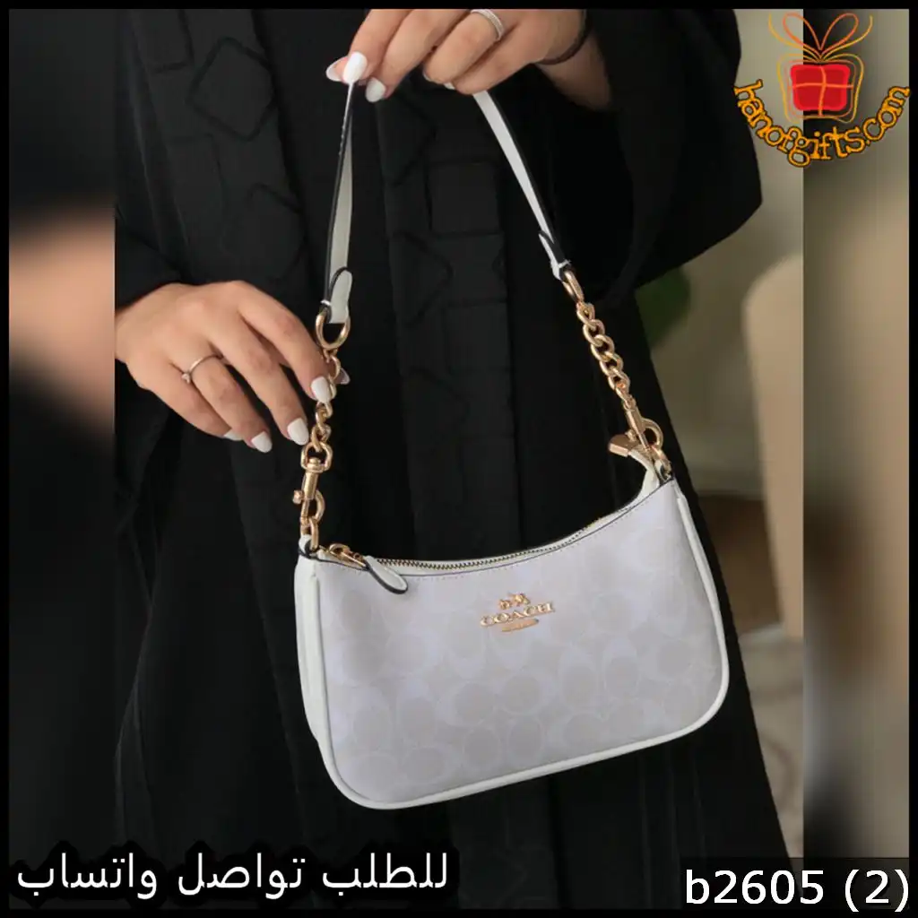 شنطة نسائية من ماركة Coach يد قصيرة