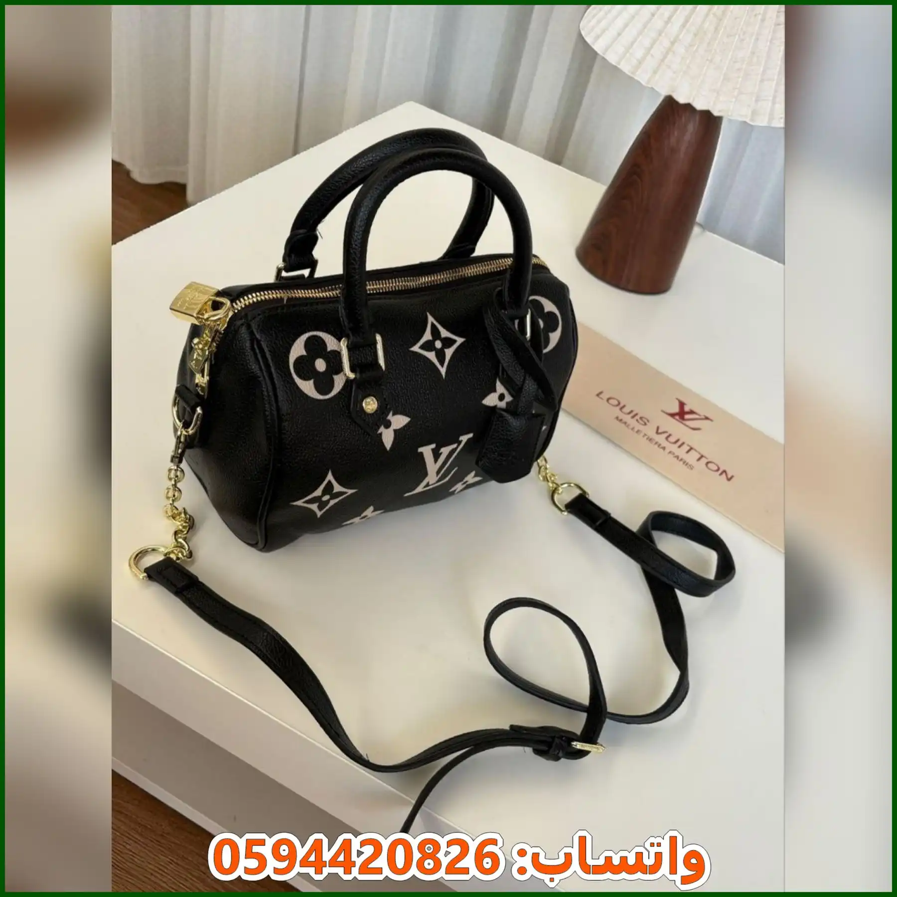 شنطة Louis Vuitton أسود بنقشة LV أبيض بارز