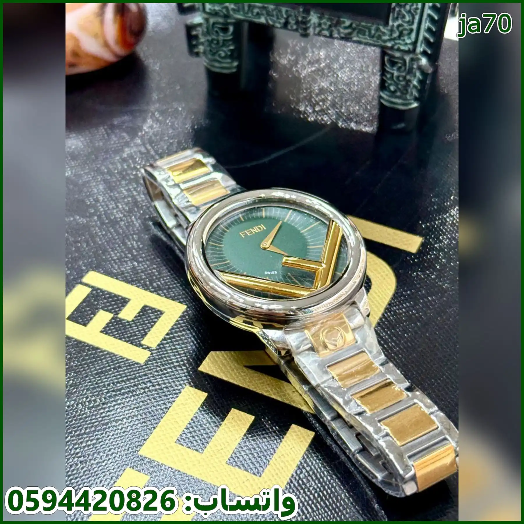 ساعه فندي دائرية نسائي 36 مكس واخضر