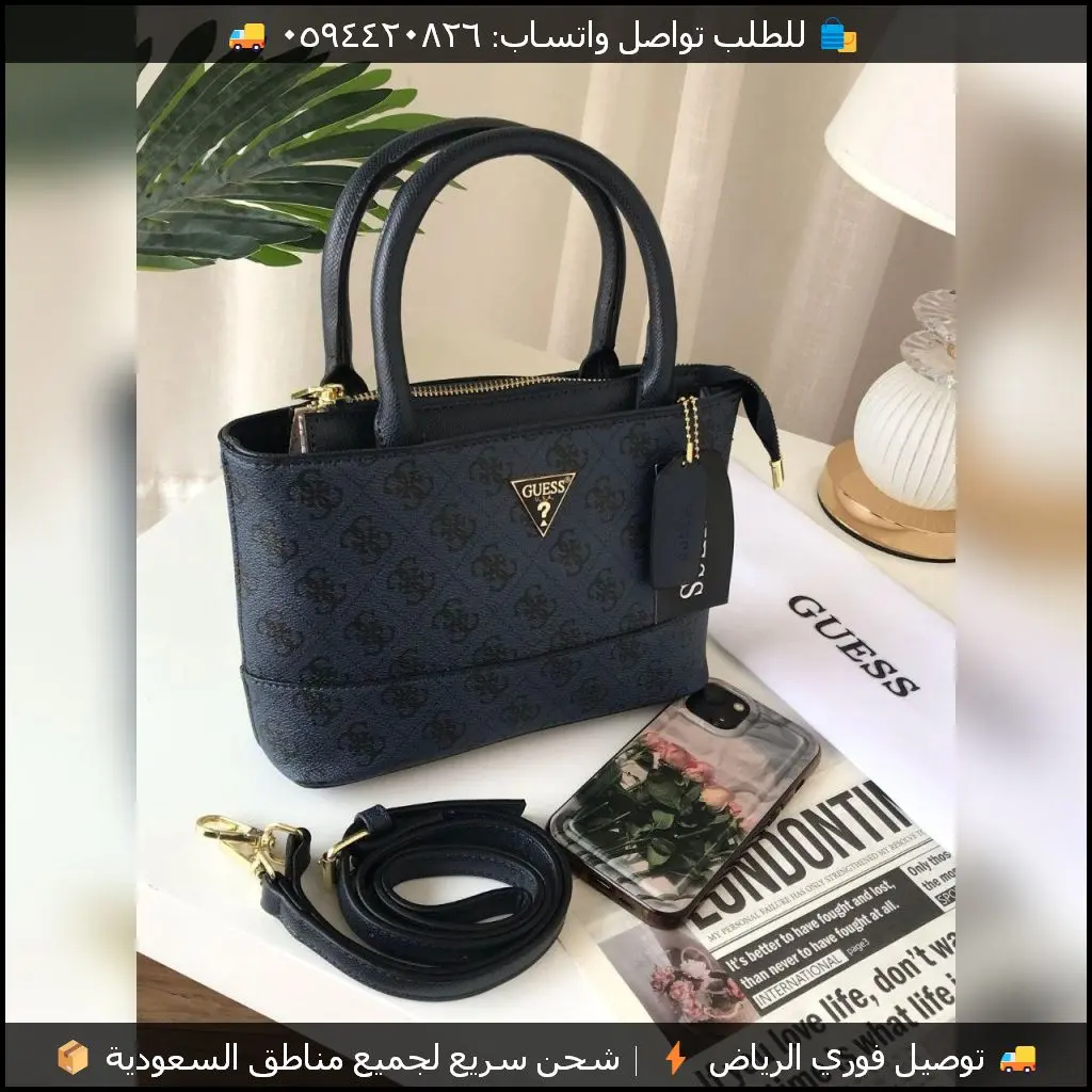 شنطة Guess كحلية بنقشة الماركة