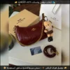 شنطة Coach Tabby مع ميدالية (أسود أبيض وردي جملي عنابي)